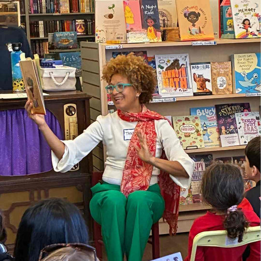 teacher reading aloud to children