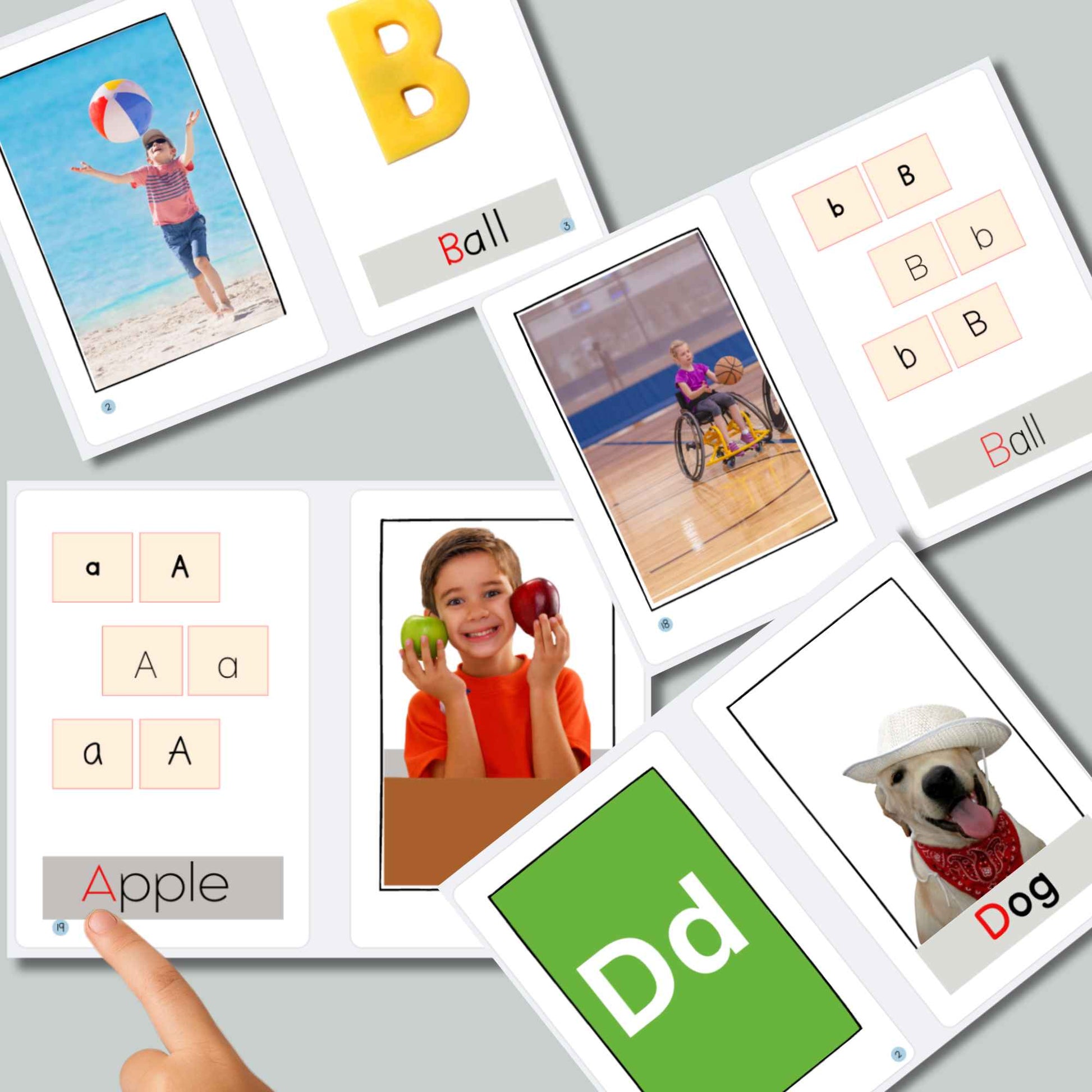 Educational flashcards with letters, words, and images on a gray surface